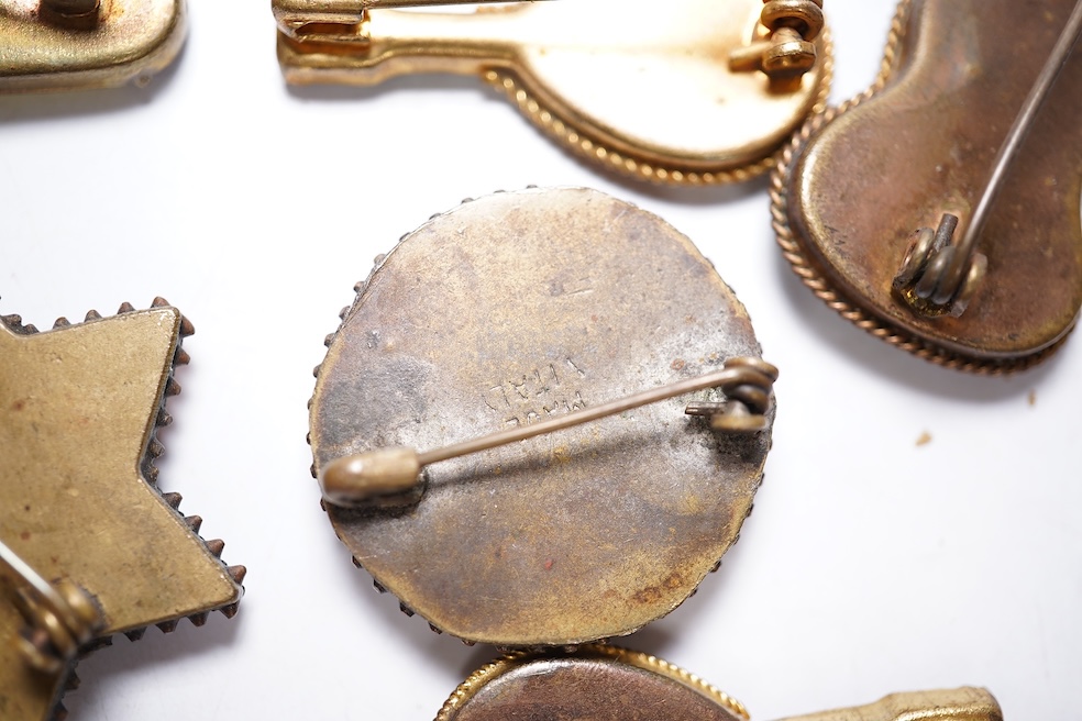A collection of thirty-one micro-mosaic brooches, including fourteen mixed guitar and banjo shaped brooches, six large oval brooches and seven smaller brooches, three long brooches and a star shaped brooch. Condition - g
